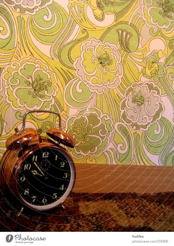 ring ring Alarm clock Clock Wall (building) Wallpaper Multicoloured Buttons Pattern Flower Flowery pattern Seventies Sixties Clock face Carpet Brown Green