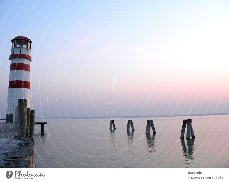 Silence (...dynamics) Lighthouse Lake Calm Footbridge Jetty Far-off places Exterior shot Podersdorf am See Sunset Dream Relaxation Austria Water Sky Freedom