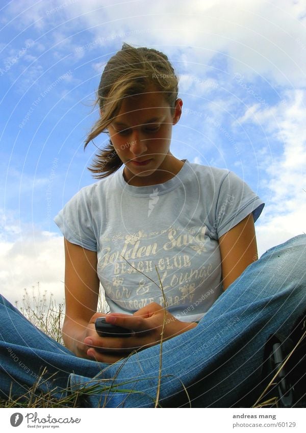 Missing him Field Woman Grass Clouds SMS Cellphone Hair and hairstyles Sky Write writing Sit Wind