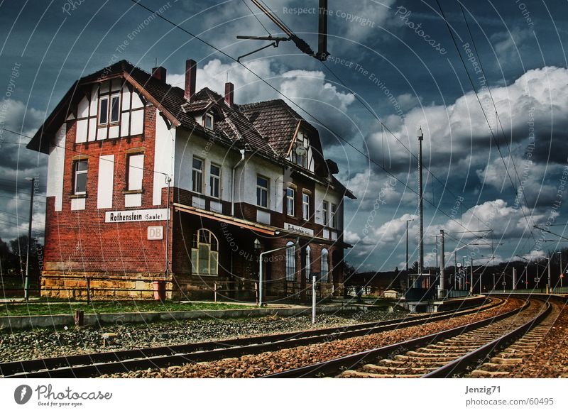 Province. Railroad Railroad tracks Overhead line Clouds Half-timbered facade Half-timbered house Train station Soft Sky