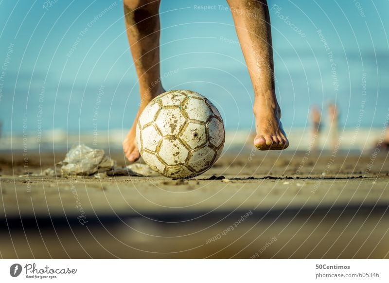 Playing football on the beach Lifestyle Leisure and hobbies Soccer Vacation & Travel Summer Summer vacation Sun Beach Sports Ball sports Human being Masculine