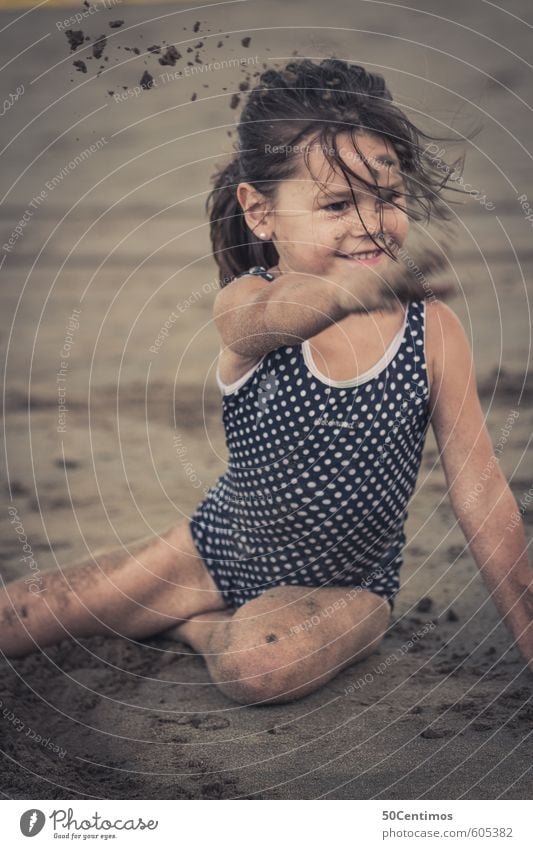 Little girl playing sand on the beach Healthy Leisure and hobbies Playing Vacation & Travel Tourism Trip Far-off places Summer Summer vacation Sun Beach Ocean
