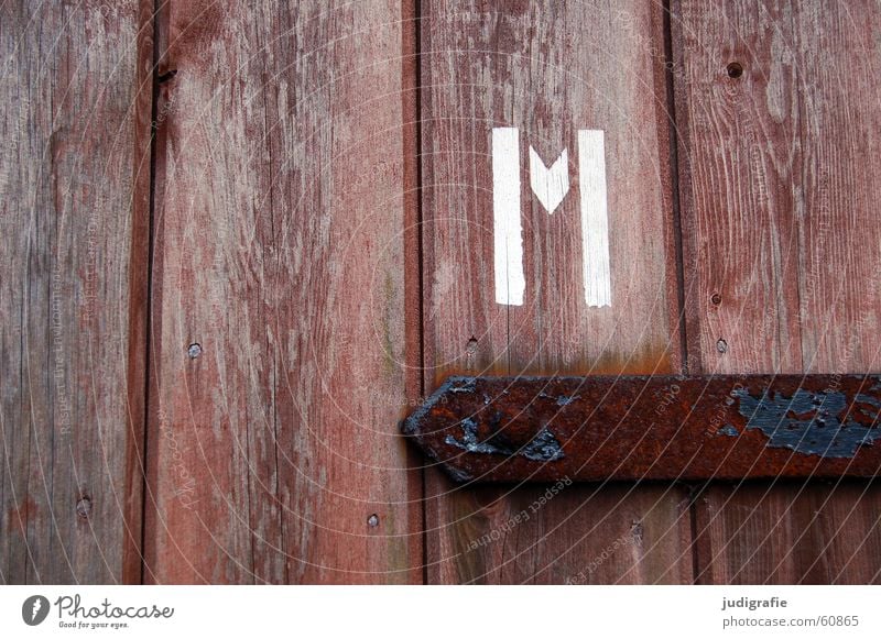 m Letters (alphabet) Typography Stencil letters Wood Wooden door Metal fitting Brown Man Gentleman Screw White Detail Colour Characters emm Door Rust Toilet