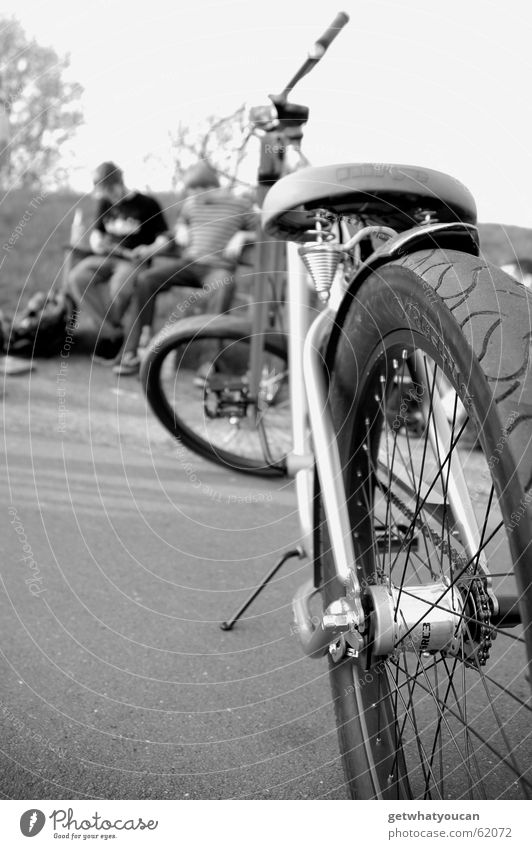 Short break Bicycle Park Calm Asphalt Stern Man Relaxation Closing time Bench Evening Black & white photo Nature Bicycle saddle