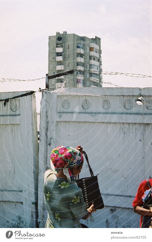 Headscarf in Osch Barbed wire Wall (barrier) Fence High-rise Woman Bag Lift Town Closed Kyrgyzstan Oppressive Enclosed Soviet Union