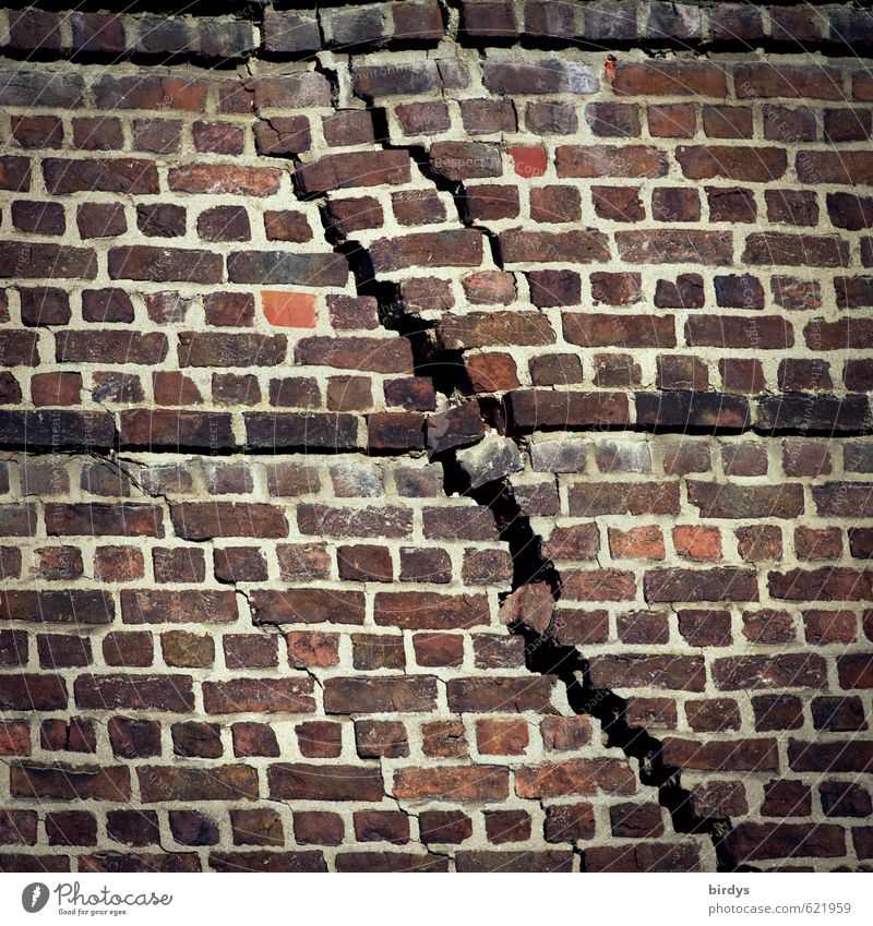 Crack in the brick wall of a building. Settlement crack, structural damage Wall (barrier) Brick wall Crack & Rip & Tear Old Exceptional Threat Broken Esthetic