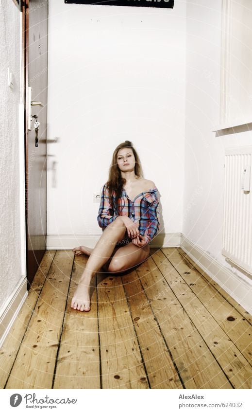 Wait a minute! Room Hallway Wooden floor Young woman Youth (Young adults) Legs Feet Shoulder 18 - 30 years Adults Shirt Barefoot Blonde Long-haired Crouch Sit