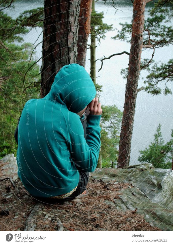 a small photographing turquoise hoodie goblin Forest Green Turquoise Hooded (clothing) Lake Photographer Take a photo Pants Leaf Brown Tree trunk Sunset Small