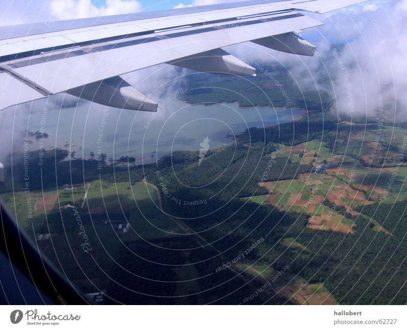 Mauritius from above Airplane Clouds Above the clouds Wing Engines Aviation