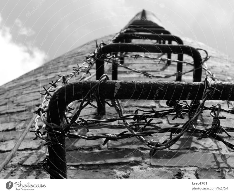 into the sky Sky Brick Barbed wire Go up Derelict Train station Black & white photo Chimney Ladder Upward prevent