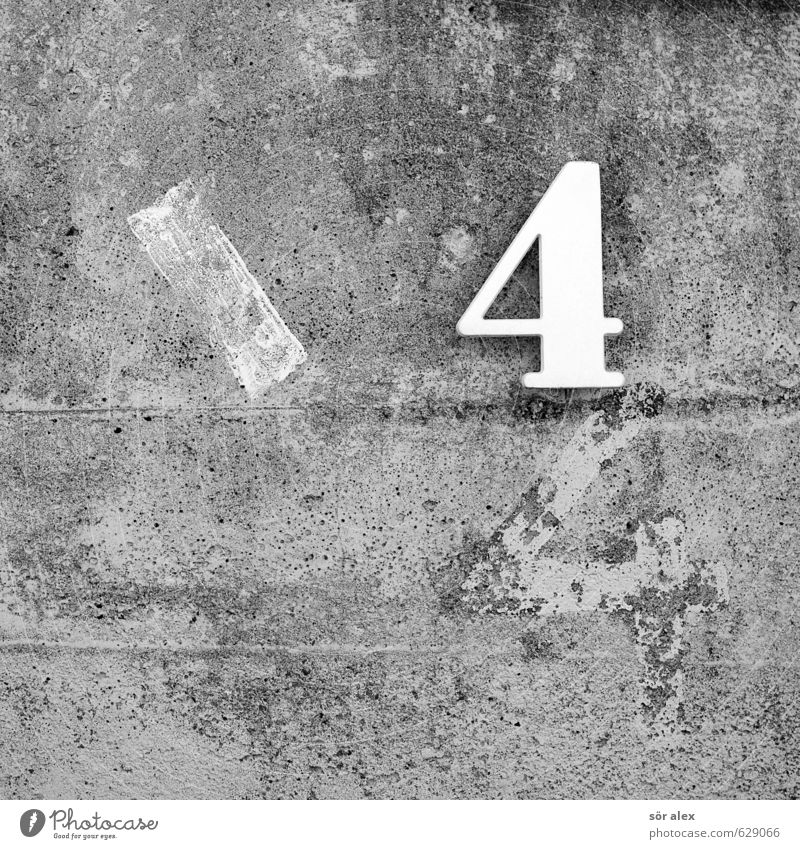 \44 Manmade structures Concrete wall House number Wall (barrier) Wall (building) Stone Plastic Sign Digits and numbers Signs and labeling White Gray Facade
