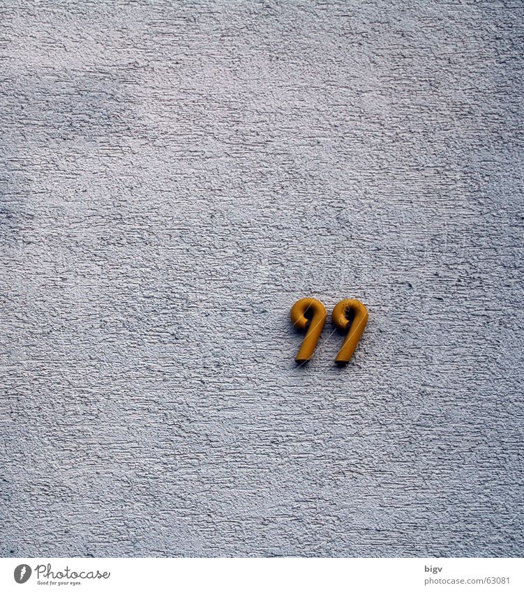 99 House number Digits and numbers Wall (building) Route 66 White Tidy up Plaster Gold ninety-nine Loneliness