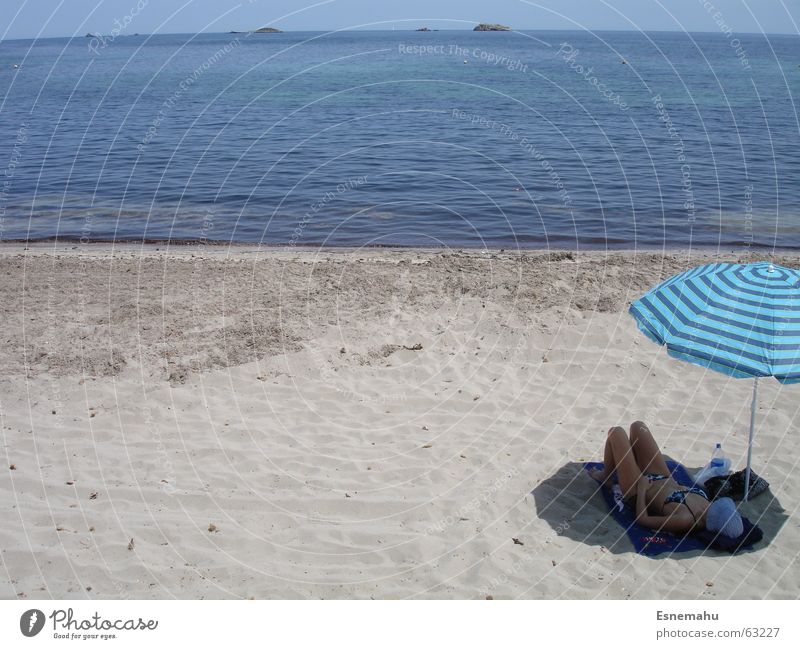 Relaxing under the screen Ocean Beach Ibiza Waves Gray White Beige Light blue Woman Couch Bikini Cap Sunbeam Sunbathing Brown Relaxation Sleep Sunshade Rod