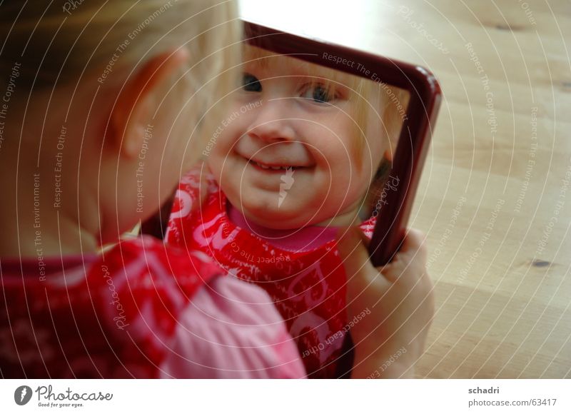 Do you see me? Child Girl Mirror Grinning Sweet Portrait photograph Red Pink Laughter