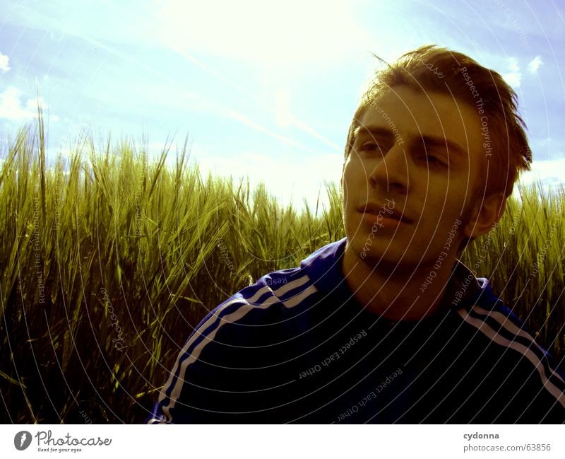 I'm going to take a break... Man Jacket Break Hooded jacket Portrait photograph Fatigue Grass Field Calm Think Summer Emotions Green Physics Concentrate