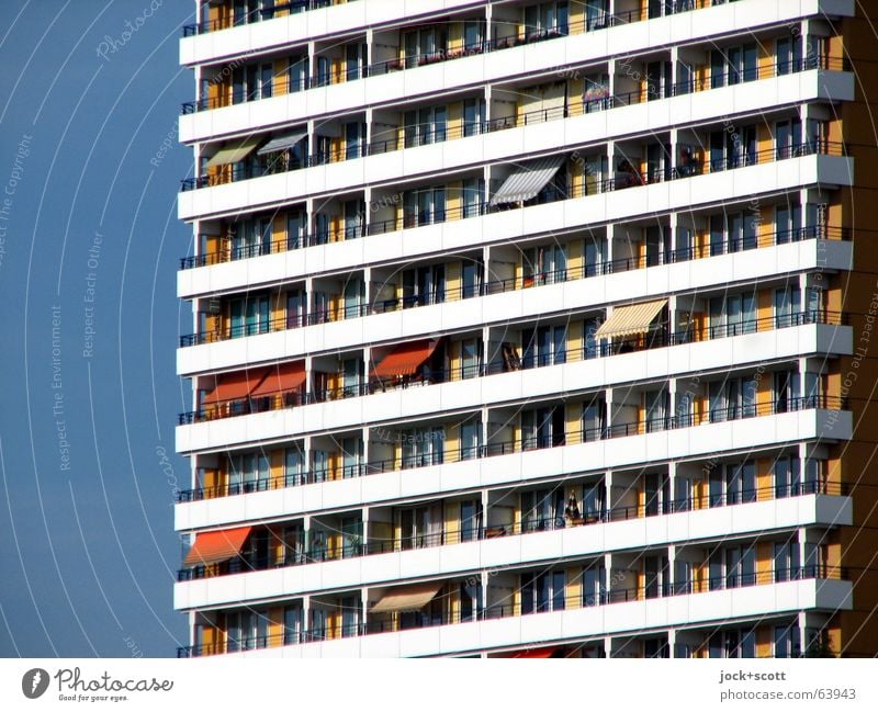 balconies, place in the sun Cloudless sky Marzahn Architecture Town house (City: Block of flats) Facade Balcony Sun blind Authentic Sharp-edged Gloomy