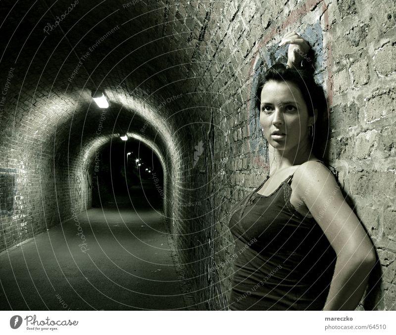 At the end of tunnel II Tunnel Stagnating Stand Dark Watchfulness Woman Light Admiration Tunnel vision Loneliness Night Think End Graffiti ponder Empty Looking