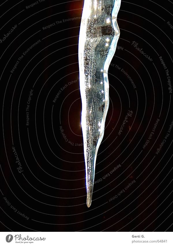 the tip of an icicle protrudes into the picture against a black background Black White Icicle Frozen Hang Freeze Ice age Dark Winter Feeble Glittering Frost