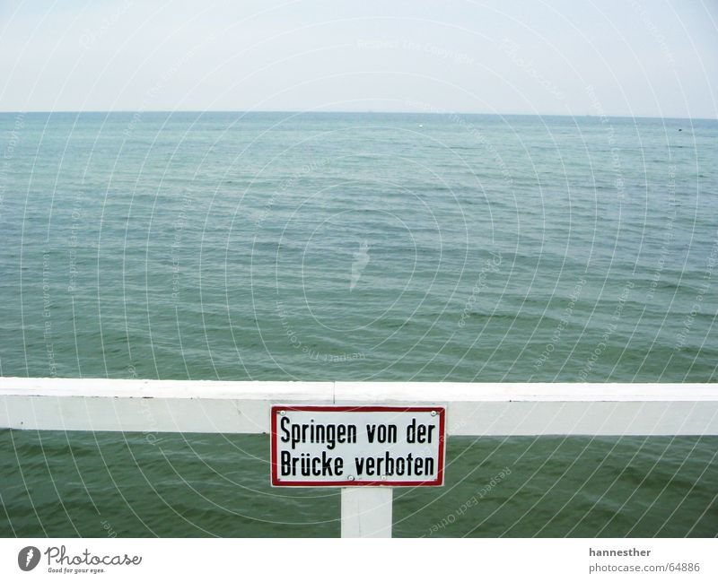 jumping is allowed Ocean Wood White Bans Deep Beach Footbridge Dangerous Bridge Water Blue Sky Signs and labeling Warning label Baltic Sea Threat