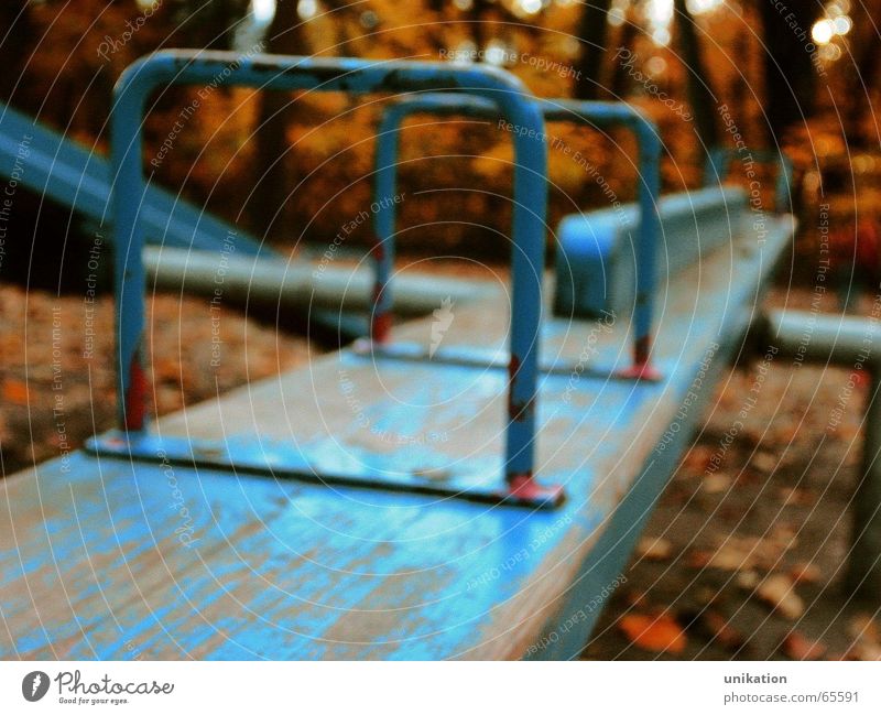 equilibrium Playing Kindergarten Infancy Autumn Weather Tree Garden Park Deserted Playground Old To swing Looking Sadness Growth Blue Loneliness Seesaw Orange