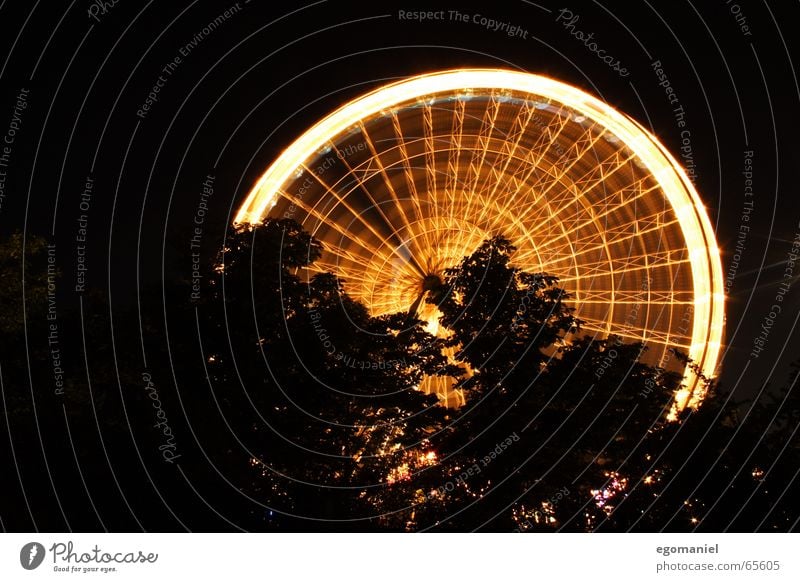 round n round n round Ferris wheel Fairs & Carnivals Night Long exposure Light Round Lighting Feasts & Celebrations Tall Vantage point Shadow