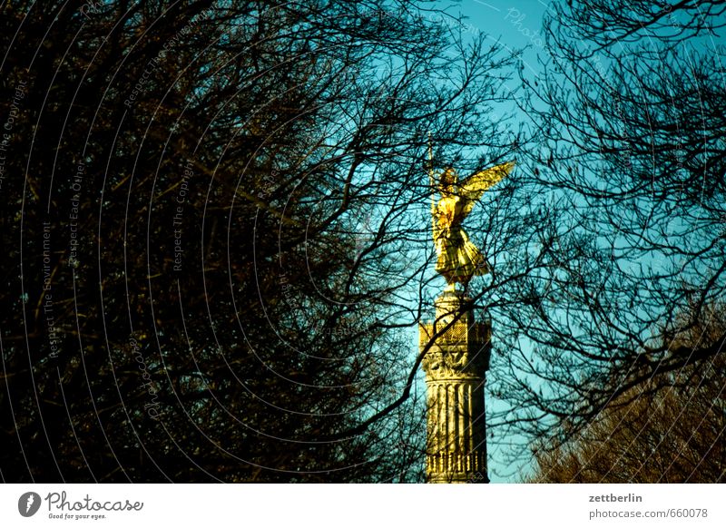 Victory column behind trees Berlin Monument Gold Goldelse victory statue big star Capital city Sky Tourist Attraction Berlin zoo Victoria Landmark Cloudless sky