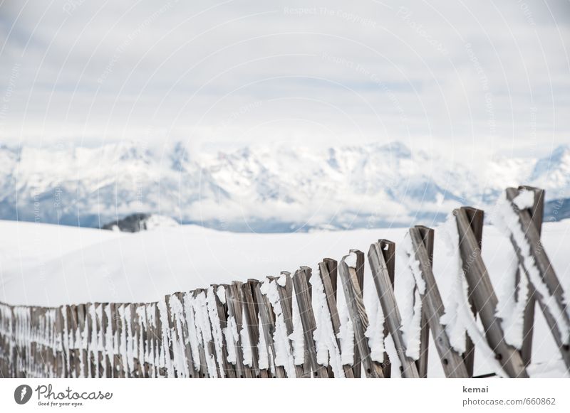 Along the fence Environment Nature Landscape Clouds Ice Frost Snow Mountain Snowcapped peak Fence Wooden fence Barrier Bright Cold White Frozen Colour photo
