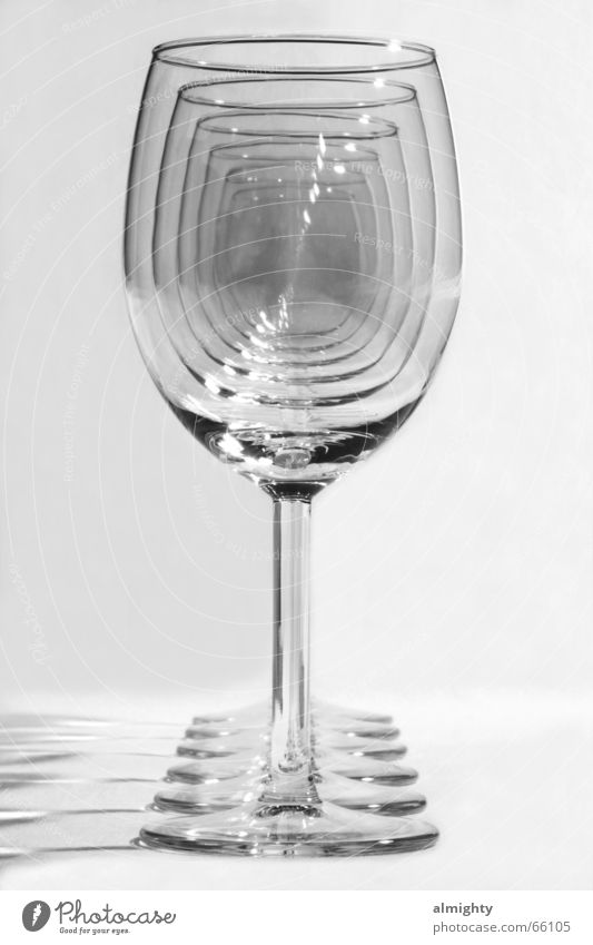 take a look deep into the glass Wine glass Black White Glass Deep Perspective Beaded Behind one another Black & white photo Isolated Image Bright background