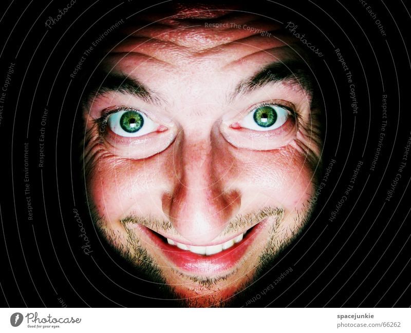 The heat is driving me crazy! Physics Man Portrait photograph Crazy Freak Dark Black Green Warmth Face Grinning Eyes Mouth Human being Looking