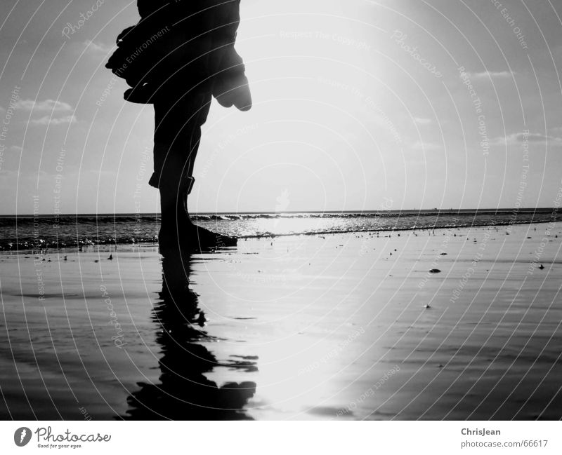 stopped Stand Beach Ocean Footwear Wet Stagnating Calm Loneliness Sky Light Relaxation Gloomy Human being Sand Water spieglung feet sewing alone