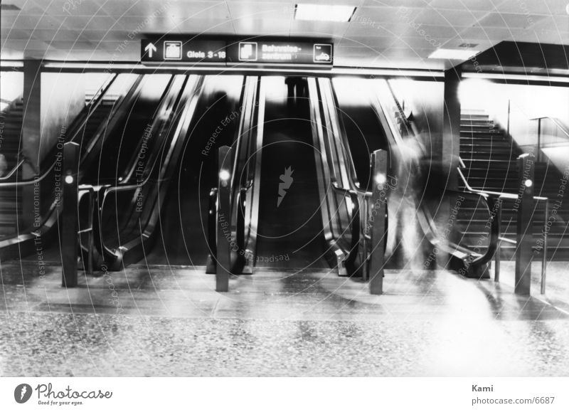 I'm a ghost Escalator Human being Train station Movement Black & white photo Ghosts & Spectres