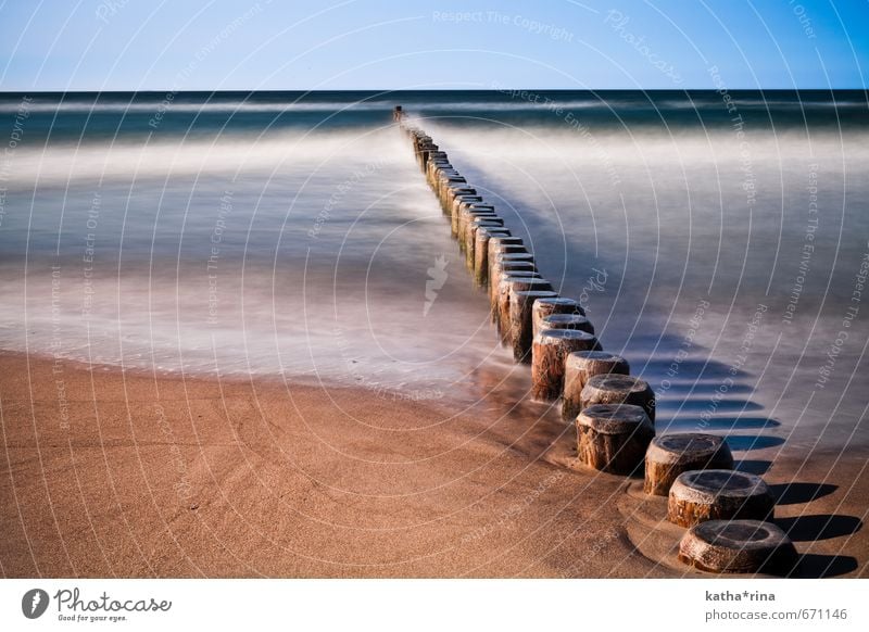 Noise . Cloudless sky Waves Beach Baltic Sea Ocean Warnemünde breakwater Sand Wood Relaxation Blue Brown Gold Calm Movement Horizon Idyll Colour photo