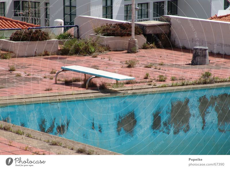Springboard into the dry Swimming pool Roof Derelict Dry Portugal Turquoise Bleached Unused Vacation & Travel Refreshment Physics Refrigeration Hotel Wellness