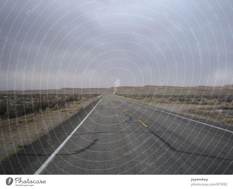 Lonely Planet Badlands Utah Deserted Godforsaken Dark Loneliness Dry Asphalt Street nowhere USA Vest no man's land