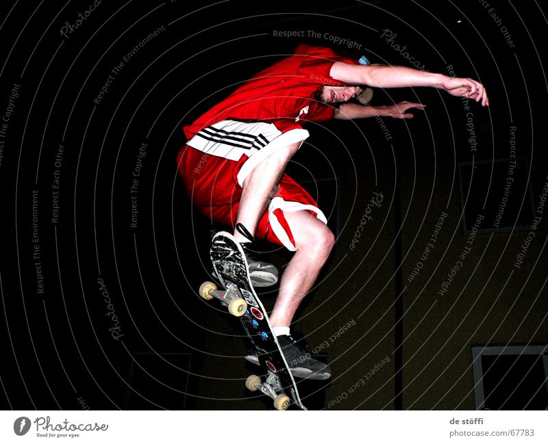 put.your.hands.up.in.the.air. Skateboarding Red Cape Dark Action Jump Fellow Young man Label Night Concentrate Clothing in midair Legs Musculature Rotate Tall