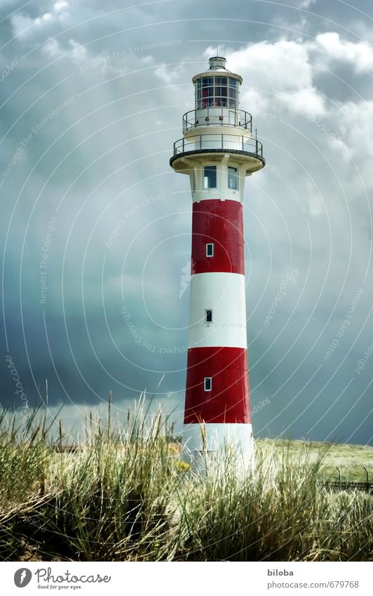 Lighthouse in bright sunbeams before approaching thunderstorm Thunder and lightning Sunbeam Storm clouds Manmade structures built Deserted Architecture