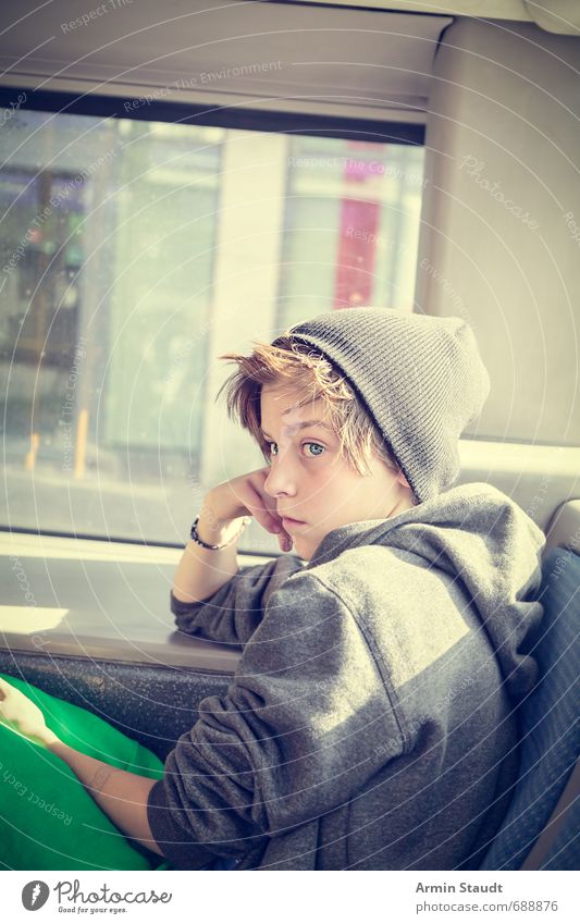 Portrait in the bus Trip Human being Masculine Youth (Young adults) 1 8 - 13 years Child Infancy Rush hour Bus Hooded sweater Cap Observe Sit Dream Sadness