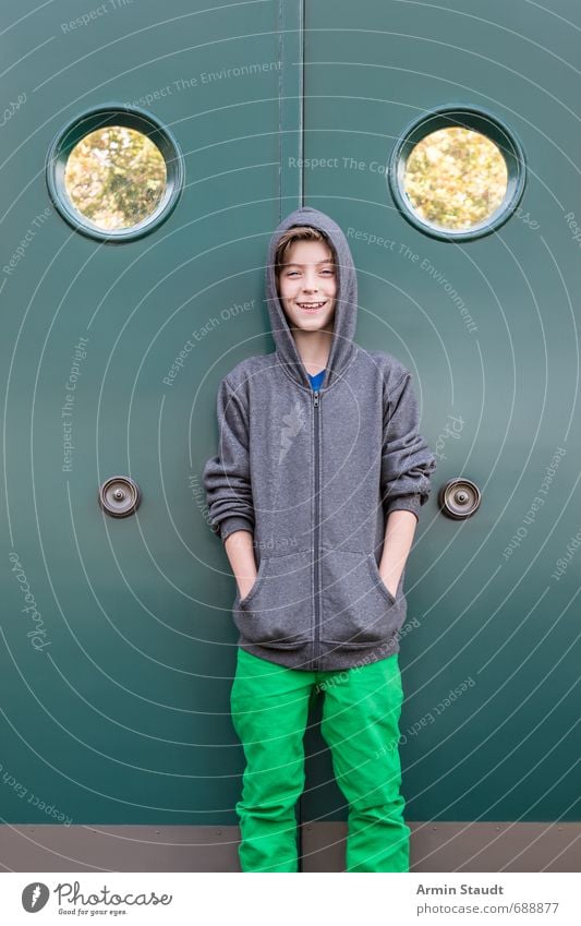 Portrait of a lucky tennage boy in front of the porthole door Style Human being Masculine Youth (Young adults) 1 8 - 13 years Child Infancy Wall (barrier)