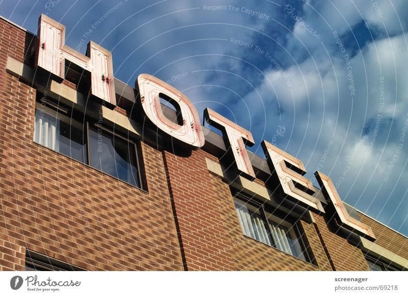 Hotel Anonymizer 1.0 Accommodation Vacation & Travel Neon sign Typography Letters (alphabet) Word Neon light Facade Wall (barrier) Brick Window Clouds Canada