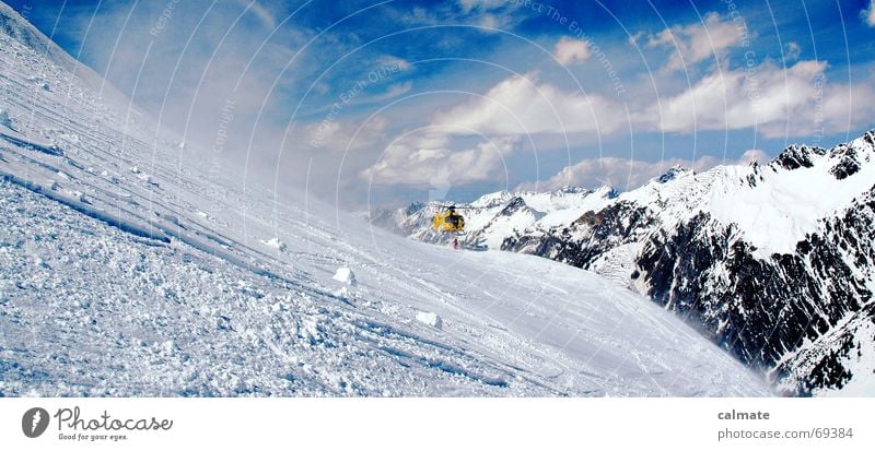 - Rescue is at hand - Helicopter Clouds Accident Skiing Snow Mountain Sky Freestyle Cause a stir Snowcapped peak Snow layer Winter sports Exterior shot