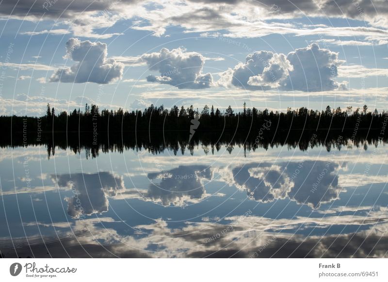 cloud reflection Lake Clouds Bad weather Mirror Mirror image Deception Surface Horizon Calm Equal Symmetry Exterior shot Tree Smoothness Surrealism Sky Division
