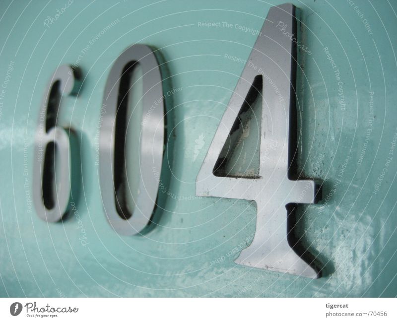 cell 604 Colour photo Subdued colour Interior shot Close-up Macro (Extreme close-up) Blur Shallow depth of field Metal Digits and numbers Cold Silver Chrome