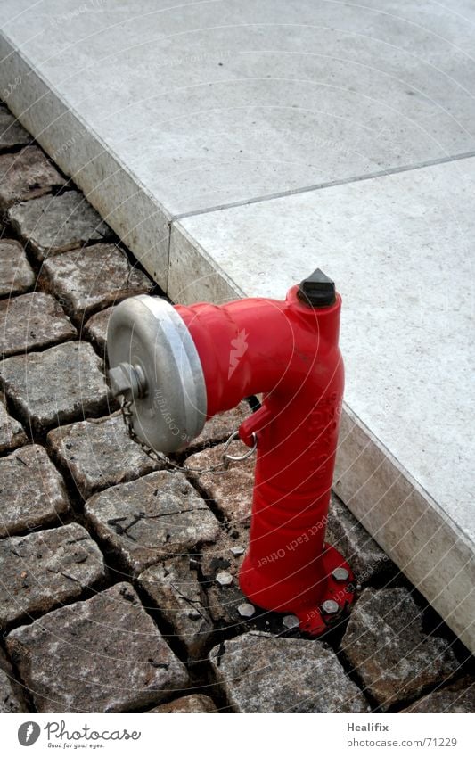 Firefighter! Water Stone Concrete Metal Gray Red Safety Protection Fire hydrant Sidewalk Cobblestones Paving stone Object photography Fire prevention Curbside