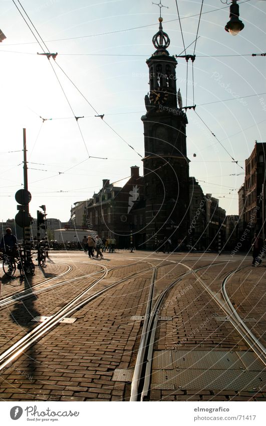 7before 7 Places Railroad tracks Tram Overhead line Light Back-light Dark Town Amsterdam Netherlands Summer evening Religion and faith Silhouette Sun Bright