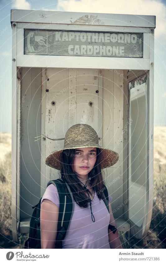 Tourist in old telephone booth Lifestyle Vacation & Travel Tourism Summer vacation Human being Feminine Youth (Young adults) 1 13 - 18 years Child Greece Hat