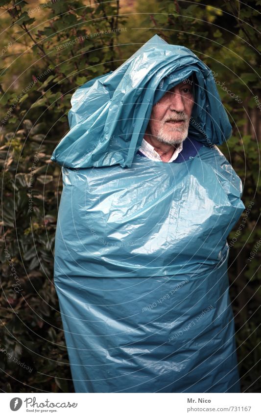 old bag Lifestyle Masculine Face Environment Tree Bushes Garden Park Facial hair Trashy Crazy Blue Garbage bag Hooded (clothing) Disguised Sculpture