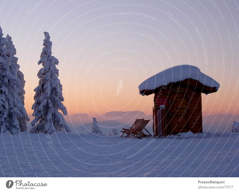 Evening impression on the mountain Snow Deckchair Coniferous trees Fir tree Color gradient Federal State of Tyrol Westendorf Sky Sunset Twilight Mountain Hut