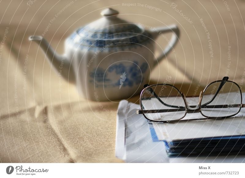 tea time Beverage Tea Well-being Relaxation Calm Leisure and hobbies Reading Table 60 years and older Senior citizen Eyeglasses Paper Emotions Moody Serene