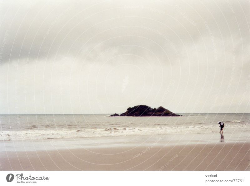 rainy beach day Beach Wet Gray Rain Australia Clouds Cloud cover Ocean Waves Far-off places Loneliness Umbrella To go for a walk Relaxation Sandy beach