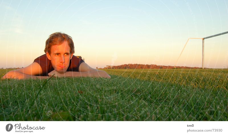 tom gate Tom Tom Relaxation Sunset Football pitch Thrashing Calm Rest Grass Ball sports Dream Horizon Gate Lawn Success Human being Sportsperson Sky